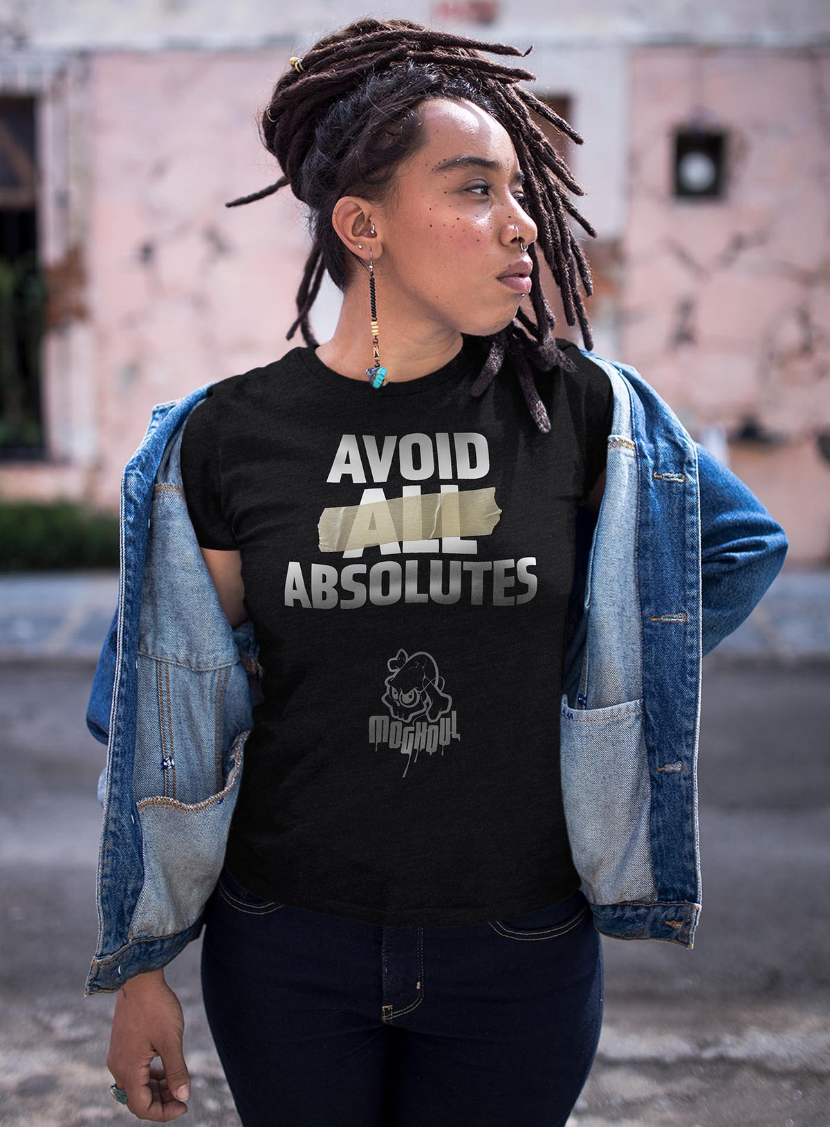 Female modeling a heather black unisex t-shirt featuring the paradoxical phrase &quot;avoid all absolutes&quot; and the moghoul logo.