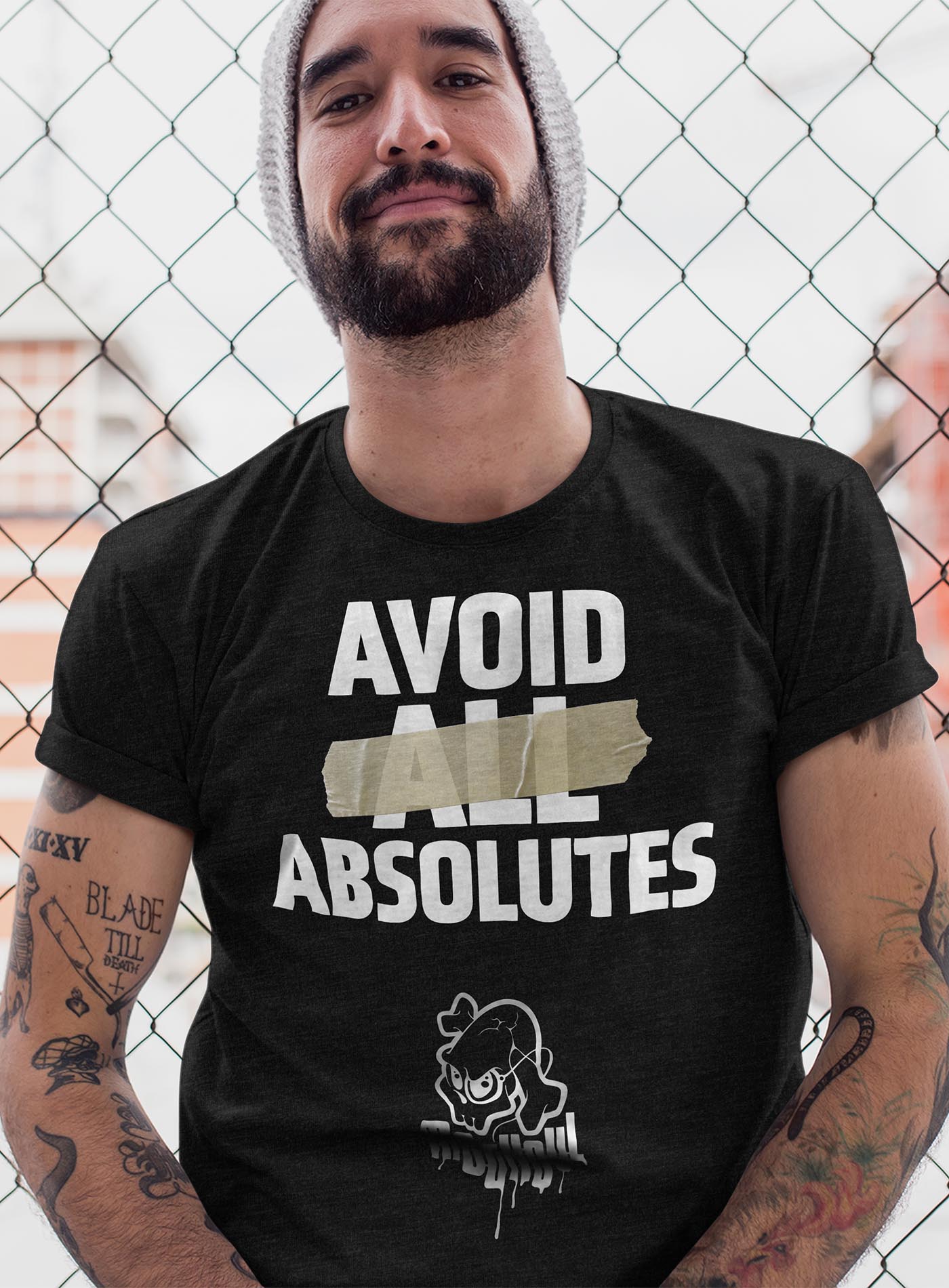 man modeling a heather black unisex t-shirt featuring the paradoxical phrase "avoid all absolutes" and the moghoul logo.