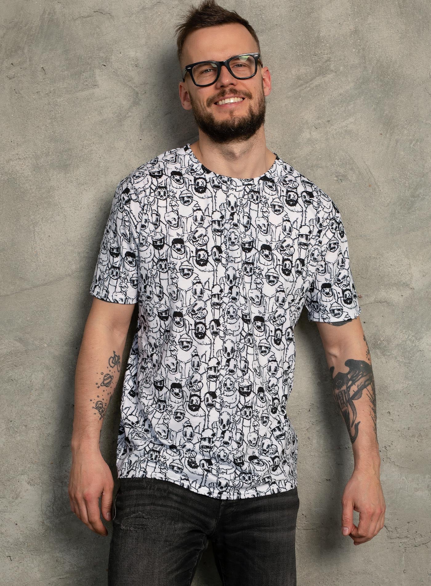 Man modeling an All over dye sublimation t-shirt featuring retro illustrated zombies by Sasha Sidorovich.