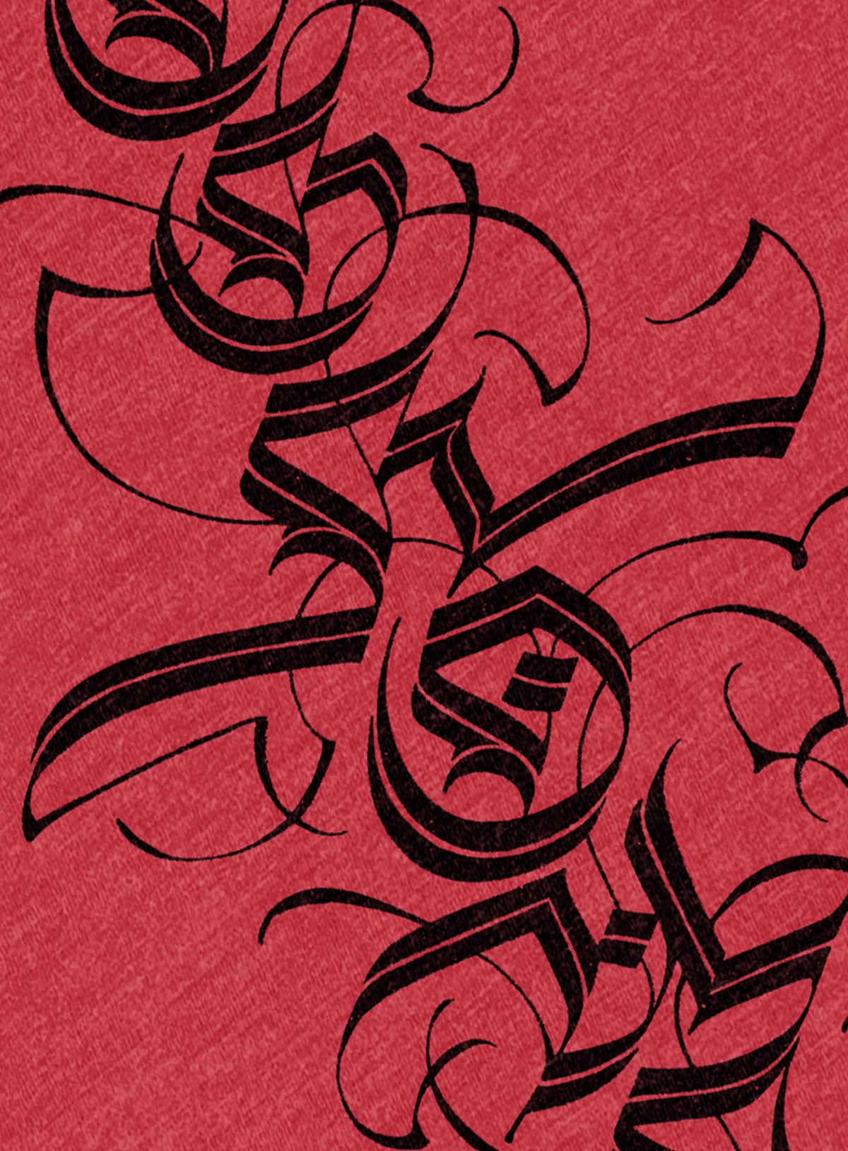 Detail of Heather red unisex t-shirt featuring a front print of a white Moghoul straight-up-gothic logo by Mexican typographer G.M. Meave.