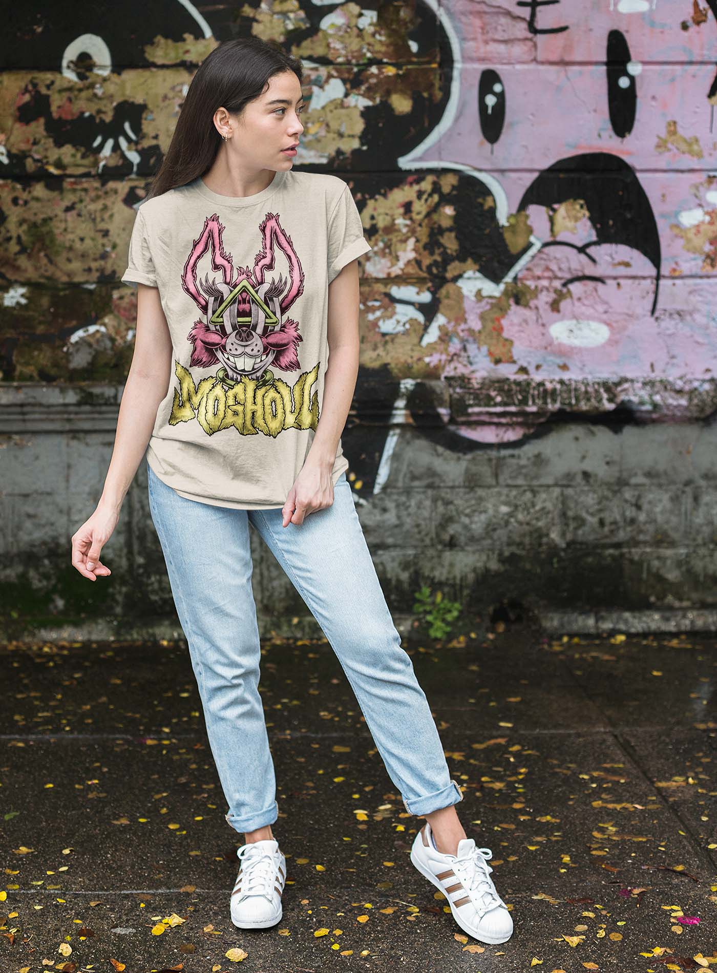 man modeling a Heather black unisex t-shirt featuring a front print of a dog and the Moghoul logo rendered in urban art style by Jason Hankins aka Jazmo.