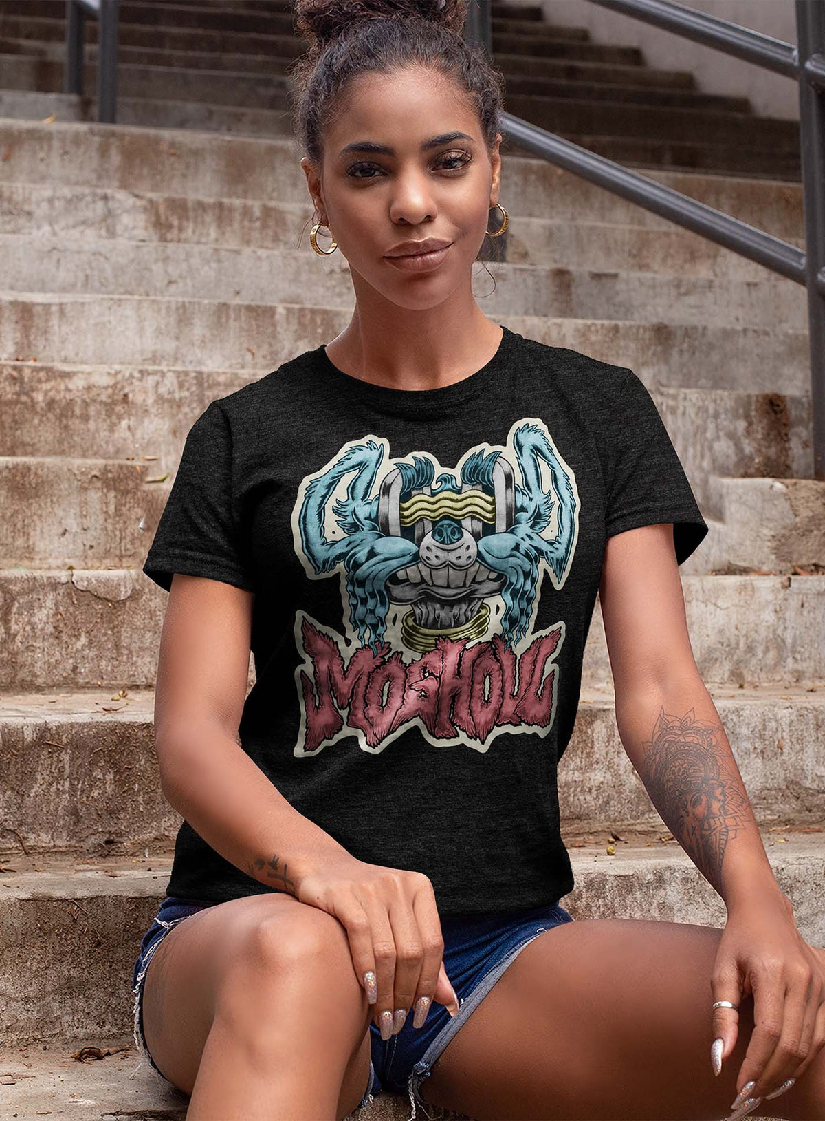 Female modeling a Heather black unisex t-shirt featuring a front print of a dog and the Moghoul logo rendered in urban art style by Jason Hankins aka Jazmo.