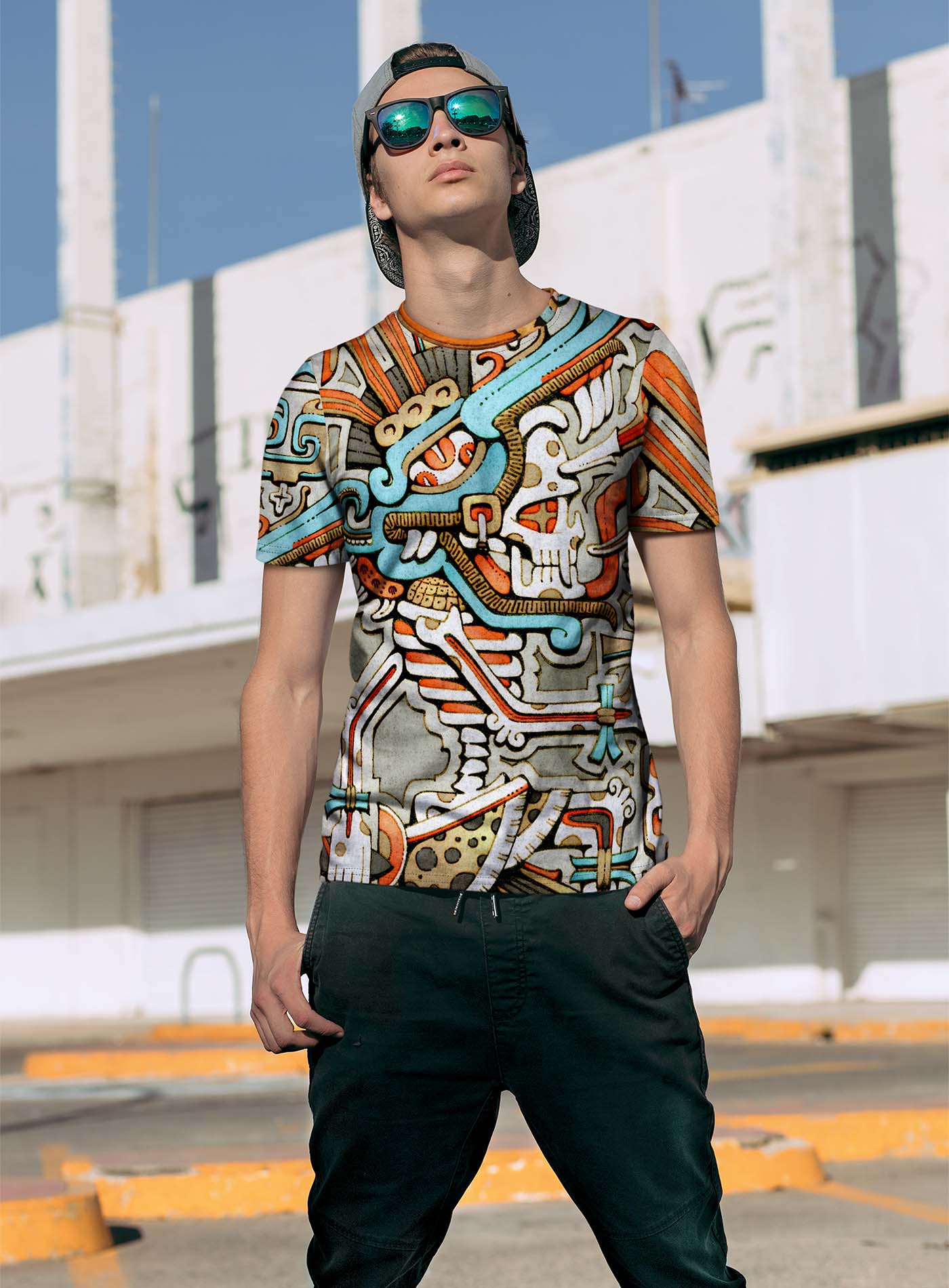 Man modeling an All over dye sublimation t-shirt featuring an illustration of the Aztec god Tezcatlipoca by G.M. Meave.