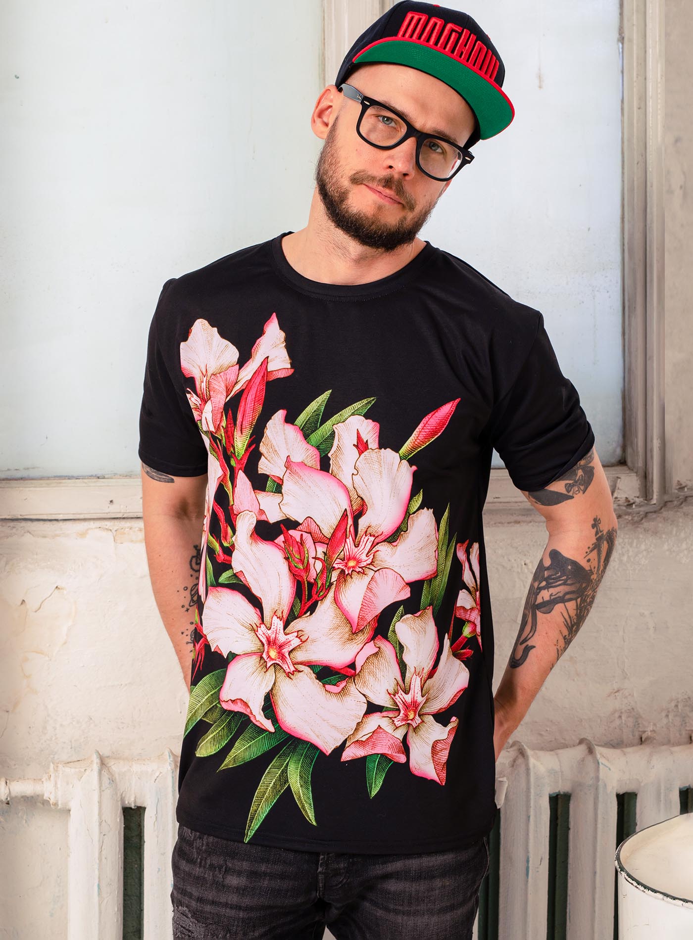 Man modeling an All over dye sublimation t-shirt featuring the poisonous flower Oleander. Illustrated by G.M. Meave.