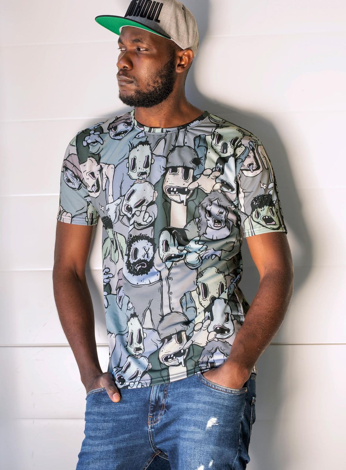 Man modeling an All over dye sublimation t-shirt featuring retro illustrated zombies by Sasha Sidorovich.