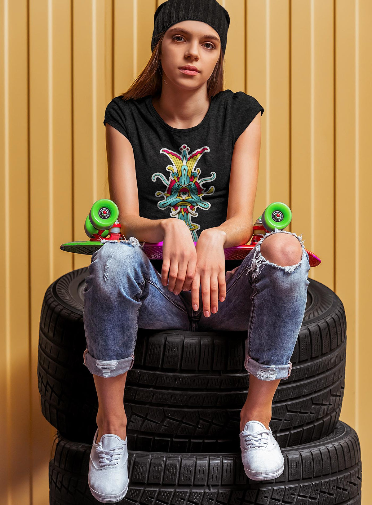 Woman modeling a Heather black women&#39;s t-shirt featuring a front print of the Toltec-Aztec goddess of grass illustrated by G.M. Meave.