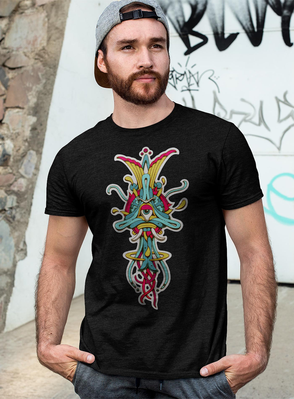 Man modeling a Heather black unisex t-shirt featuring a front print of the Toltec-Aztec goddess of grass illustrated by G.M. Meave