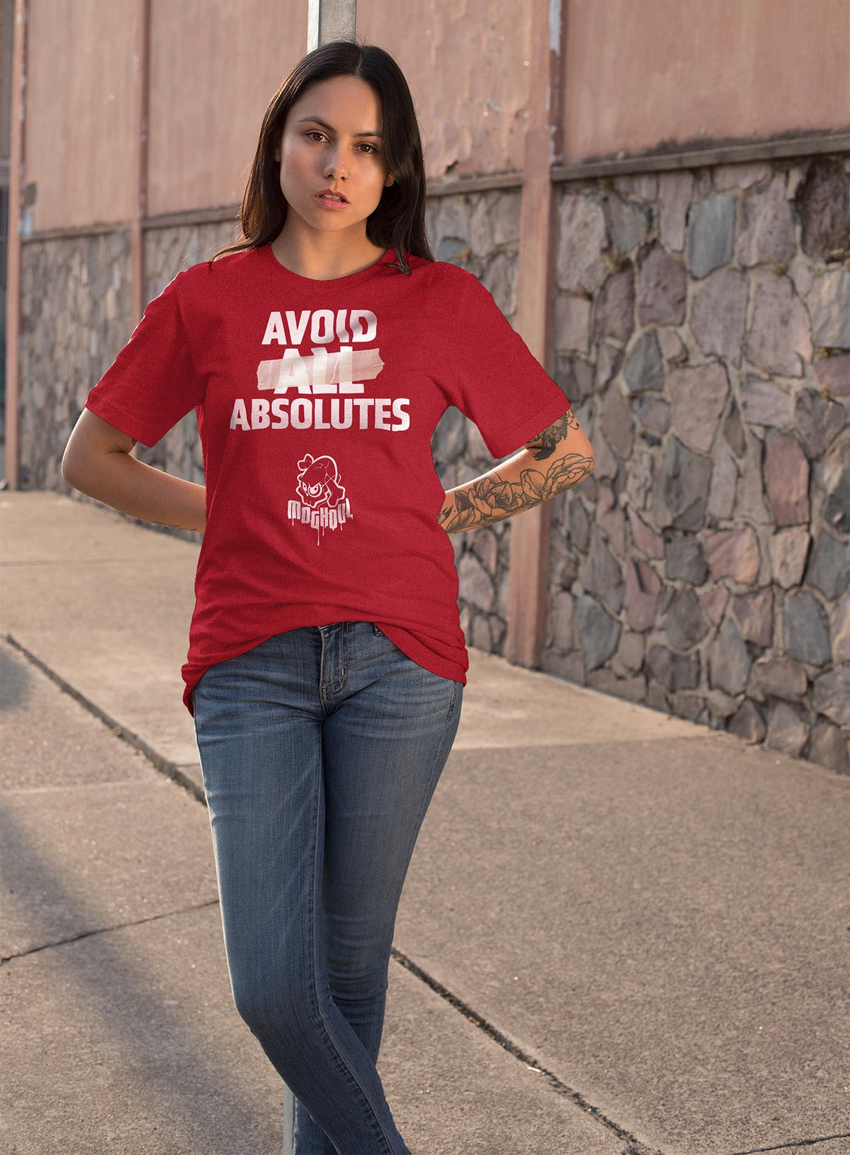 Female modeling a heather red unisex t-shirt featuring the paradoxical phrase &quot;avoid all absolutes&quot; and the moghoul logo.